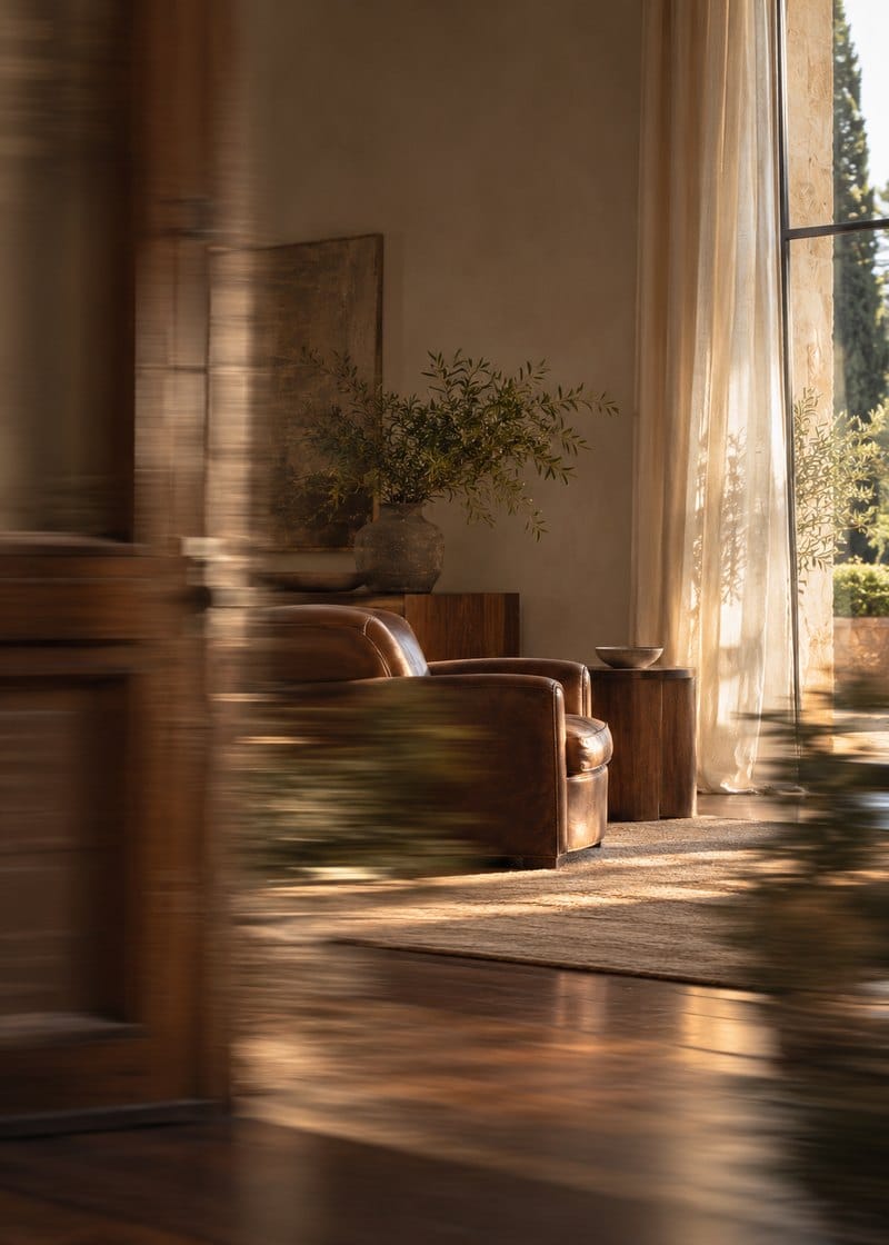 A quiet study with bookshelves and a desk by the window